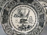 two black and white plates with designs on them on a table