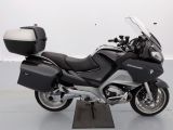 a picture of a black and silver motorcycle parked in a garage