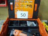an orange tool box with tools in it sitting on a table