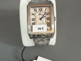 a watch that is sitting on a table with a price tag