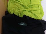 a box full of clothes that is sitting on top of a bed