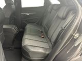 the back seats of a car with a seat belt in the back of it