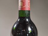 a bottle of wine that is sitting on a table