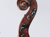 an old violin with a wooden back and a black bow