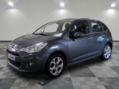 the grey citrole is parked on a checkered floor