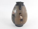 a vase with a picture of a man and a woman on it