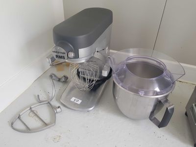 a mixer and a blender sitting on a counter