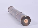 a pen that is laying on a white surface