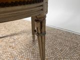a chair that is sitting on a tile floor