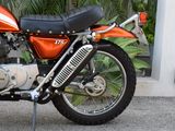 a motorcycle that is parked on the side of the street
