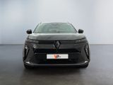 the front view of a grey car in a white room