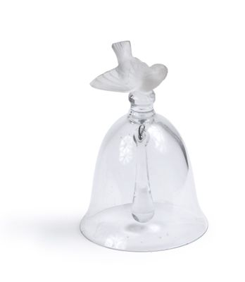 a glass bell with a bird on it on a white background