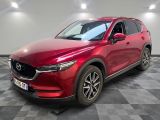 a red mazda cx - 5 parked on a checkered floor