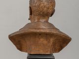 bust of a man with a beard on a wooden base