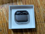 a box with an apple airpods in it on a wooden table