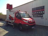 a red truck that is parked in front of a building