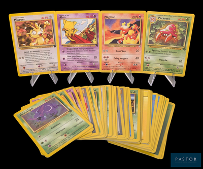 a lot of pokemon cards that are on the table