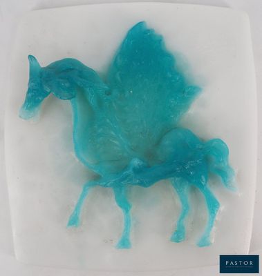 a picture of a blue plastic horse on a white plate