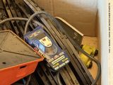 a pile of electrical equipment in a room with a box
