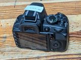 a camera that is sitting on a wooden table