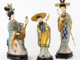three asian figurines of women with hats and holding musical instruments