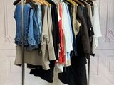 a rack with clothes on it in a room