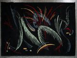 a black rug with a picture of a bird on it