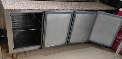 an image of a kitchen with granite counter tops and stainless steel appliances