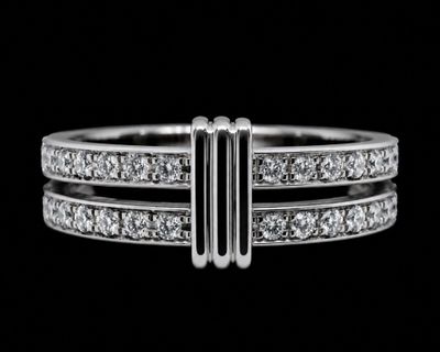 a close up of a diamond ring on a black background
