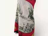 an image of a red and white scarf with a picture of people on it