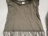 an image of a shirt with fringes on it
