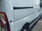 a white van that is parked in a parking lot