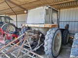 a tractor that is parked inside of a building
