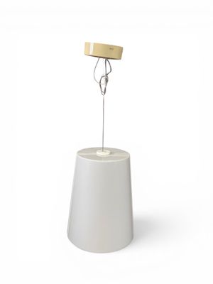 an image of a white lamp with a wooden base on a white surface