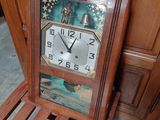 a wooden chair with a clock on the back of it