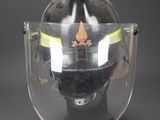 a helmet with a helmet attached to it on a black surface