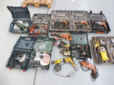 a lot of tools that are laying out on the floor