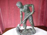 a statue of a man with a dog on a table