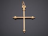 an image of a gold cross on a black background