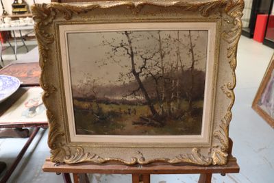 a picture of a painting on a easel in a room