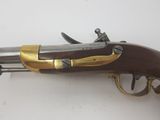 a close up of a gun on a table with a white background