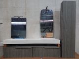 a bathroom with a sink and a mirror on the wall