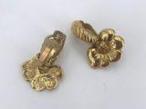 a pair of gold tone flower charms