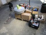 a dog that is standing next to a pile of boxes