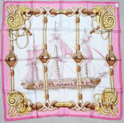pink and gold square scarf with a sailing ship on it