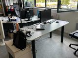 a desk with a chair and a computer on it