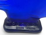 a blue glass sculpture of a bird on a black base