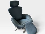 an image of a blue chair and ottoman on a white background