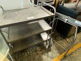 a metal cart that is sitting in a room