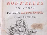an old book with a picture of a man riding on a horse